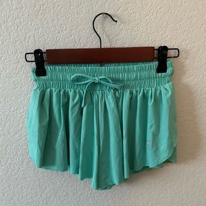 green flowy shorts